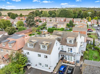 Aerial view of the residential facility and surrounding homes