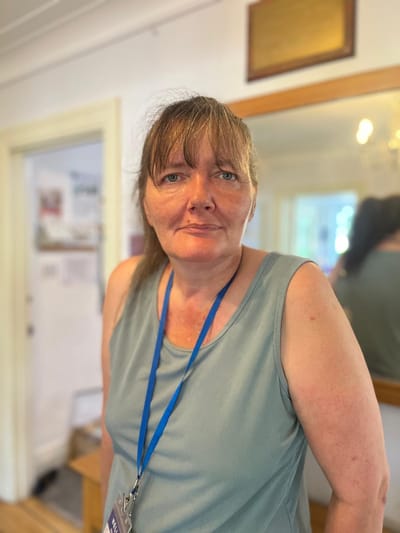 Staff member in a common area of the facility