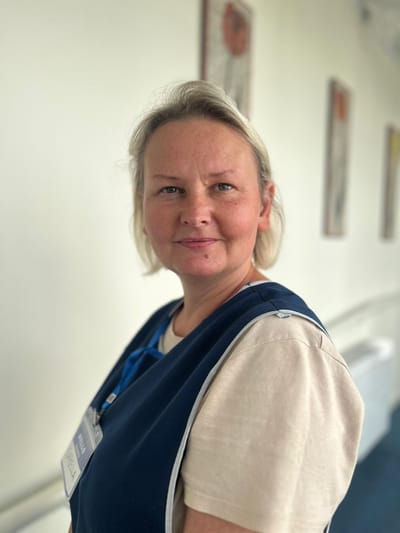 Staff member in a facility corridor
