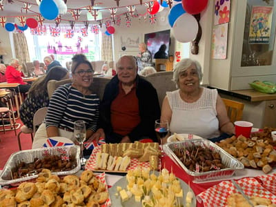Residents enjoying a celebration with food and decorations
