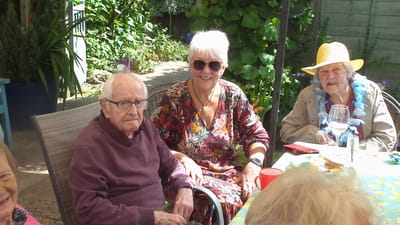 Residents enjoying time in a garden area