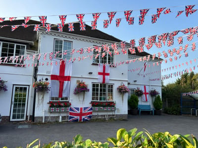 Exterior view of the facility decorated with flags