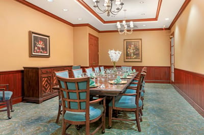 Dining room with a large table set for a meal