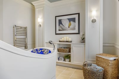 Well-designed spa-like bathroom with amenities