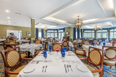Elegant dining room setup with tables and decorations
