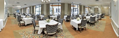 Dining area with elegant tables and floral centerpieces