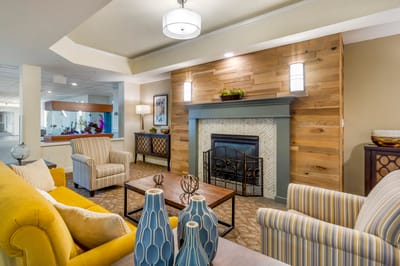 Cozy common area with comfortable seating and a fireplace