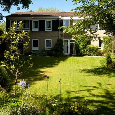 Well-maintained garden area in front of a building