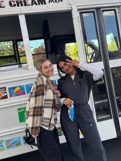 Two staff members enjoying an ice cream event