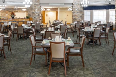 Dining room with tables set for residents
