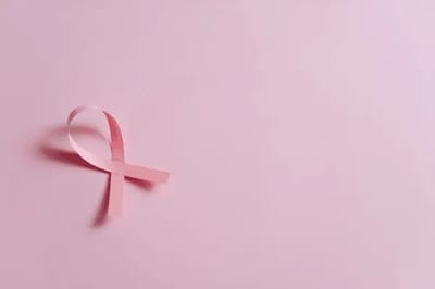Pink ribbon on a pink background