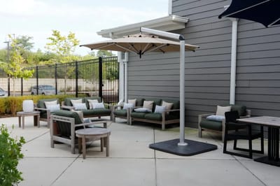 Outdoor seating area with umbrellas and lounge chairs
