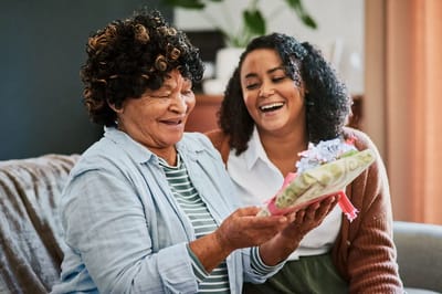 Two women enjoying a moment together indoors