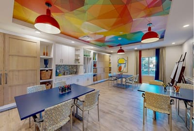 Bright activity room with colorful decor and tables