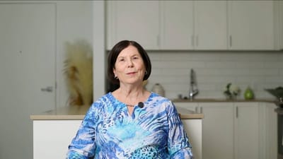 Resident smiling in an interior setting