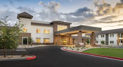 Exterior view of the facility entrance with landscaping