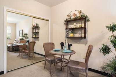 Cozy resident room with a dining table and chairs