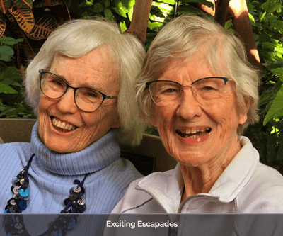 Two smiling residents enjoying each other's company