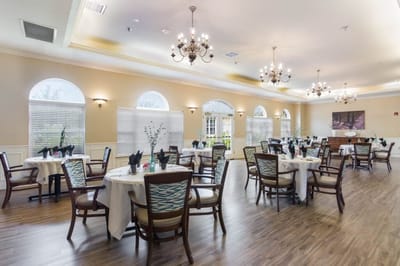 Dining area with tables set for residents