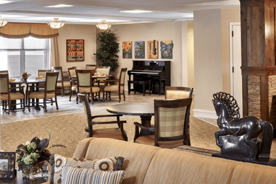 Common area in a senior living facility with seating and decor