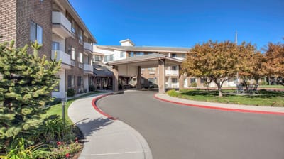 Exterior view of Cadence at Olney, featuring gardens and pathways
