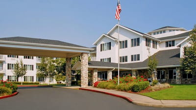 Exterior view of Cadence at Olney with landscaped entrance