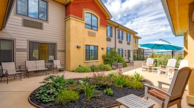 Outdoor seating area with landscaped garden