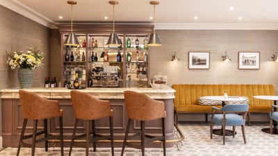 Bright interior of a bar area with seating and decor