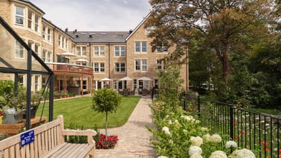 Outdoor view of Mill View assisted living facility with garden