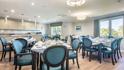 Dining room setup with tables and chairs