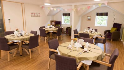 Dining area with tables set for a meal