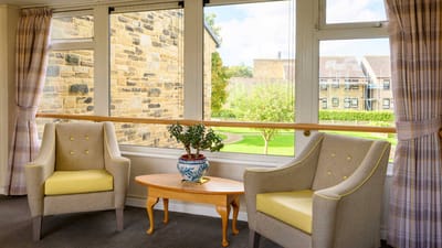 Cozy indoor seating area with a view of the garden
