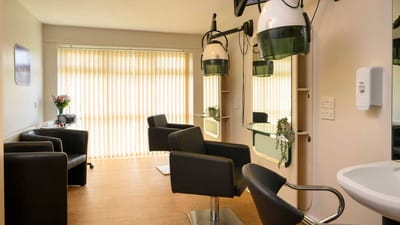Bright salon area with hair styling stations
