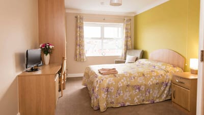 Cozy private room with a bed and decor
