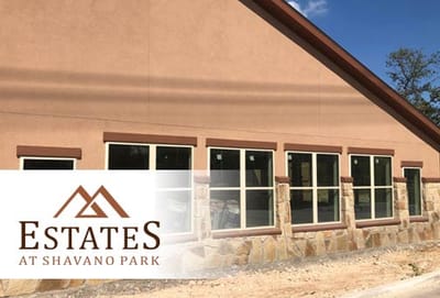 Facility logo with building exterior in background