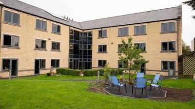 Exterior view of the facility with outdoor seating area