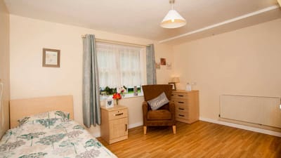 Cozy resident room with furniture and decor