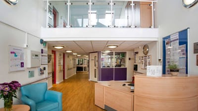 Bright interior lobby with reception and seating area