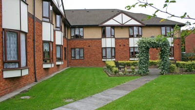 Well-maintained garden area with paths and shrubs
