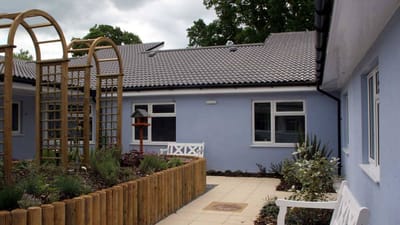 Outdoor space with garden and nearby building