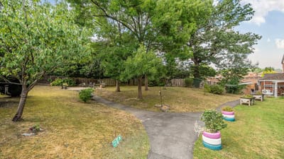 Outdoor garden area with paths and seating