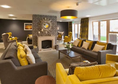 Bright and inviting common area with yellow accents