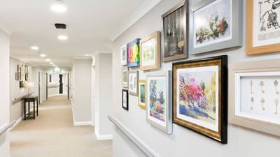 Bright hallway decorated with framed artwork