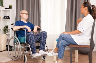 Healthcare professional talking with an elderly resident