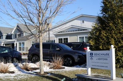 Exterior view of Benchmark at Newtown with vehicles