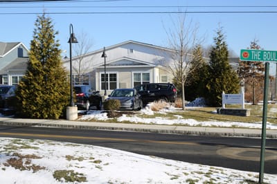 Exterior view of Benchmark at Newtown with snow and landscaping