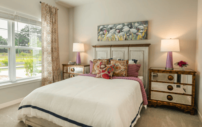 Bright and cozy resident bedroom with floral decor