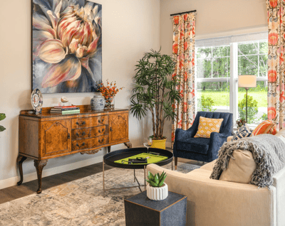 Cozy living area with floral artwork and comfortable seating
