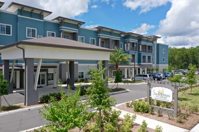 Exterior view of Seagrass Village facility with landscaped entrance
