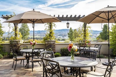 Outdoor seating area with umbrellas and flowers